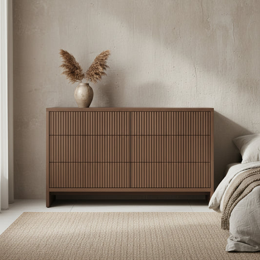 Brown wooden dresser with three drawers on a white background