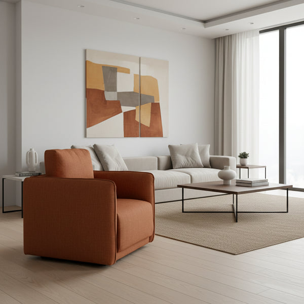 Brown armchair in a room with a striped wall, plant, and small table with books.
