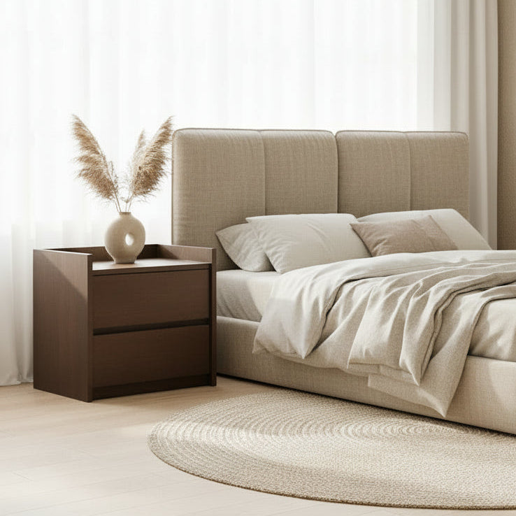 Wooden nightstand with a lamp on a bed corner