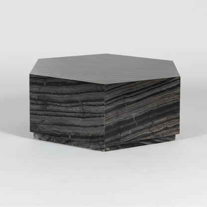Hexagonal side table with a dark, textured surface on a white background