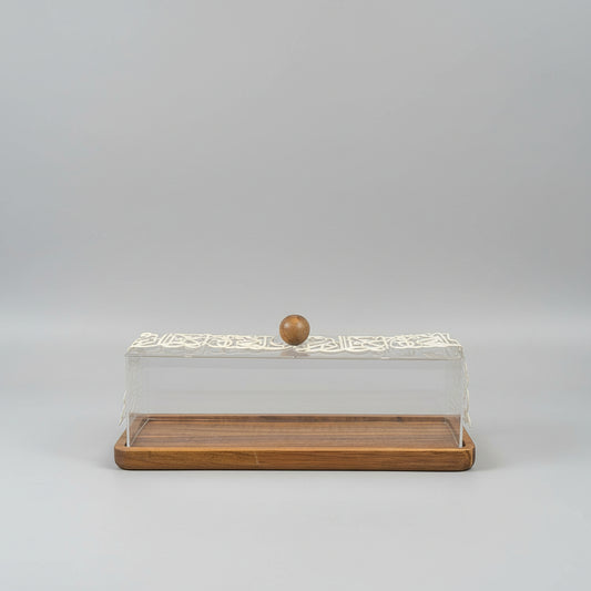 Wooden display case with a clear lid on a dark surface against a light gray background