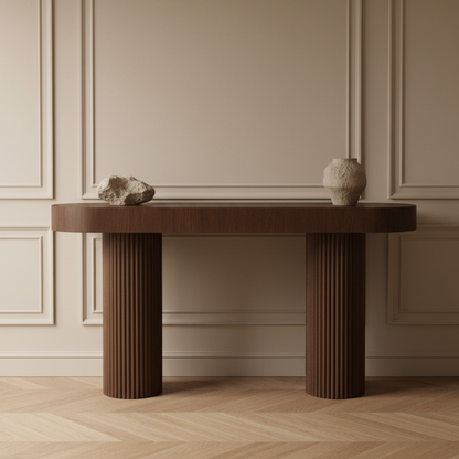 Wooden console table with decorative items against a beige wall.